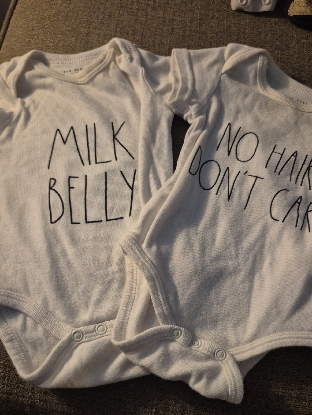 Rae Dunn White Baby Onesies with Black Lettering
